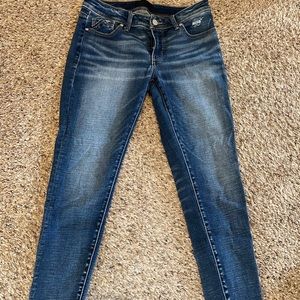 Women buckle black skinny jeans